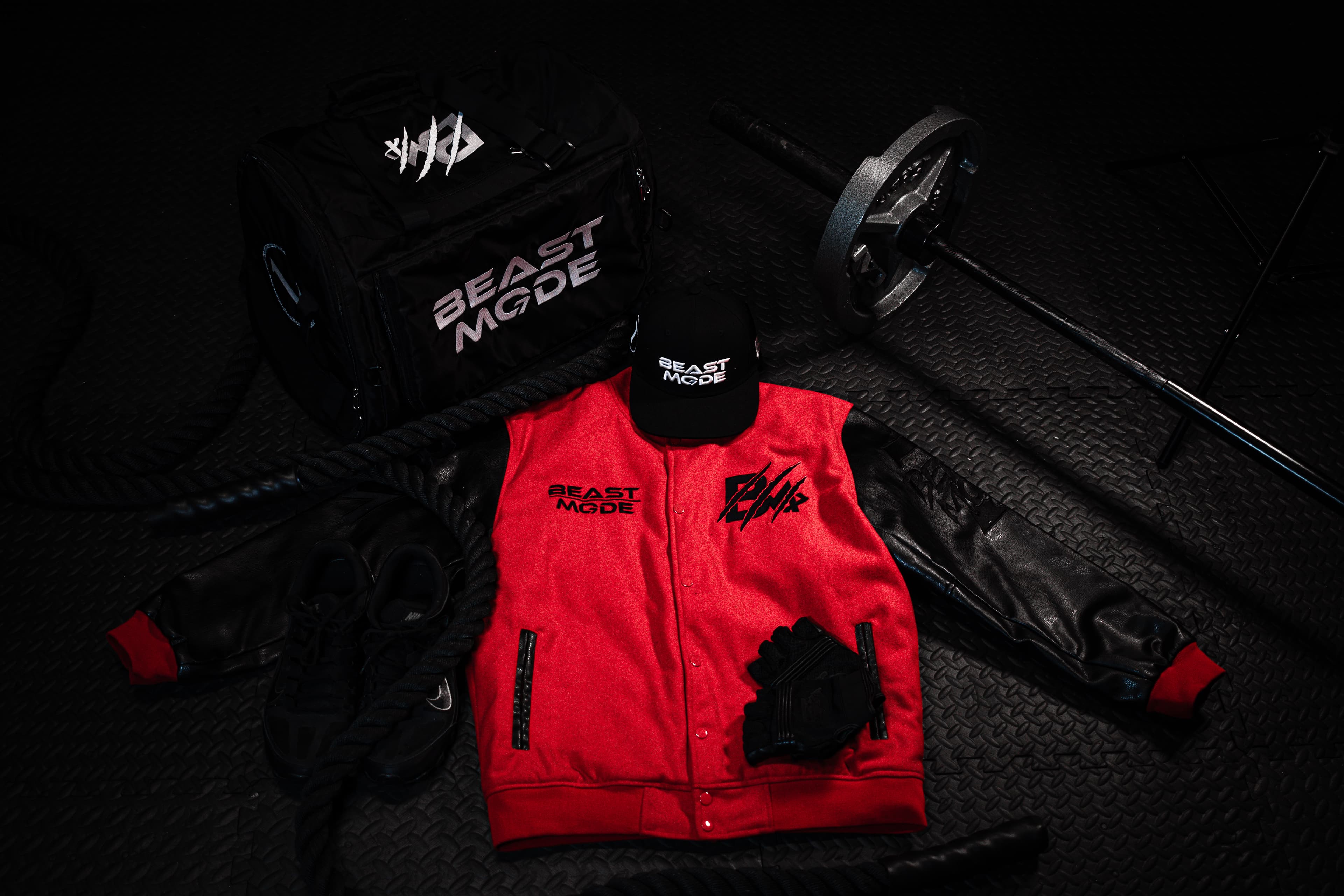 Brand product flatlay with Beast Mode apparel and gym equipment